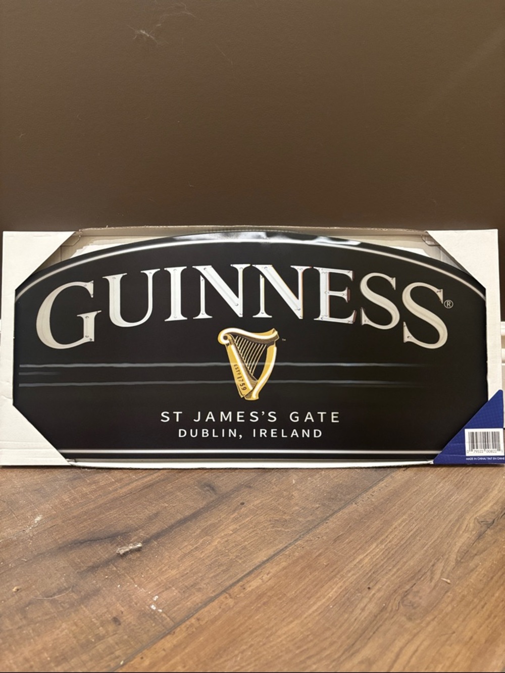 Guinness Black Sign with Gold Harp and White Lettering